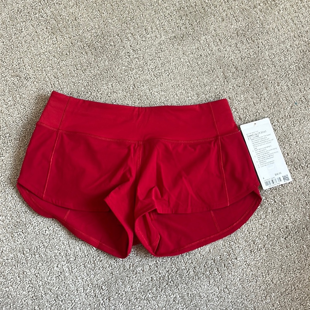 BRAND NEW. NEVER WORN. LULULEMON SPPED UP SHORTS (RED). SIZE: 4 REGULAR.